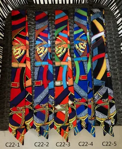 Detailed flat lay of silk twilly scarves with equestrian horse bridle print patterns