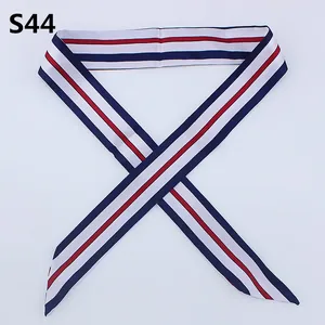 Detail of red, white and navy striped silk twilly scarf for handbag handle decoration