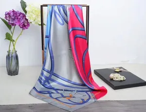 Detail of elegant 90cm silk scarf with vintage chain belt print and floral decor