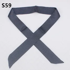 Detail of navy blue silk-like skinny scarf with white polka dots for bag handles