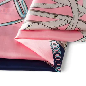 Close-up of silk scarf showing vintage chain belt patterns and smooth fabric texture