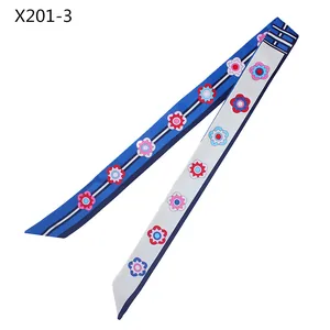 Detail of 120cm blue floral satin twilly scarf showing elegant pattern and silk-like texture