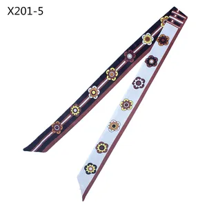 Detailed flat lay of 120cm long skinny silk scarf with retro sunflower geometric pattern