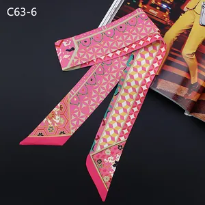 Pink floral print silk-like twilly scarf with geometric patterns on black background
