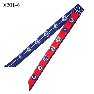 Detail of 120cm twilly silk scarf showing geometric flower patterns and dual-tone finish