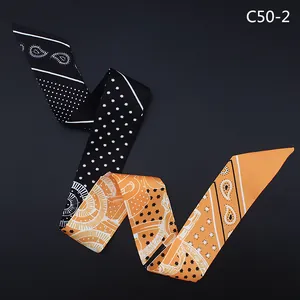 Ethnic style hip hop skinny scarf in black and orange with paisley star patterns