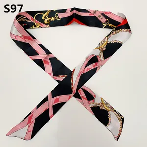 Detail of slim twilly scarf with equestrian chain patterns and pink ribbon motifs