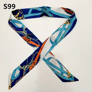 Detail view of equestrian-style silk scarf with horse harness pattern and floral accents
