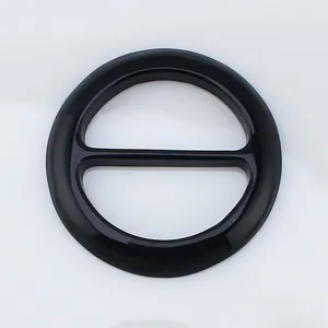 Close-up of a glossy black circular scarf buckle featuring a double-ring connector design
