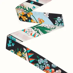 Close-up of a 120cm floral silk-feel scarf twilly with elegant flower patterns