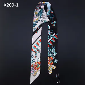 Detailed close-up of a 120cm twilly scarf featuring floral and geometric patterns