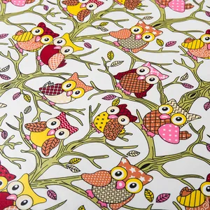 Detailed pattern showing colorful cartoon owls and leaves on the silk scarf fabric