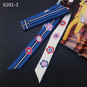 Blue floral long silk scarf with geometric patterns and stripes on black background