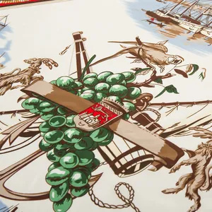 Detail of nautical silk scarf with vintage sailing ship, anchor, and heraldic patterns