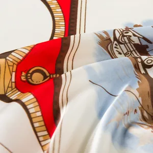 Close-up of silk scarf with nautical sailing prints and detailed rope patterns on fabric