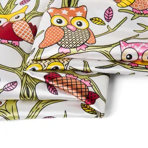 Detailed view of 90cm silk scarf fabric featuring vibrant owl and branch patterns