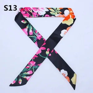 Narrow silk scarf for handbag handle featuring elegant pink floral patterns on black