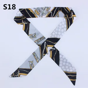 Elegant silk bag handle scarf with chain and geometric patterns in gold and black