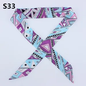 Slim silk twilly scarf with blue and purple geometric patterns for handbag handles