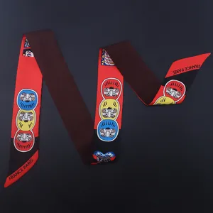 Narrow silk twilly scarf with cartoon Daruma dolls and France Paris print on black background