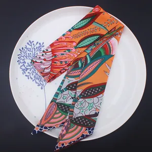 Close-up of bohemian floral silk twilly scarf for handbag handles and neckwear styling