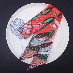 Detail of bohemian floral print silk twilly scarf showing smooth texture and vibrant colors