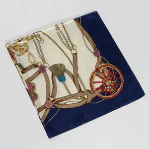 Detailed close-up of retro equestrian print silk scarf with golden chain and tassel design