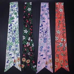 Vertical display of four floral print twilly silk scarves in white, black, pink and orange