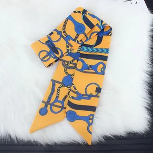 Equestrian pattern yellow twilly silk scarf with horsebit chain print on white fur