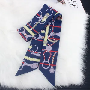 Navy blue equestrian silk scarf with harness print on elegant white faux fur backdrop
