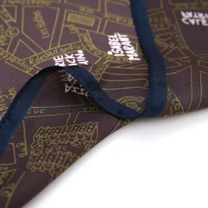 Close-up of silk scarf with vintage map print and dark blue satin hem finish