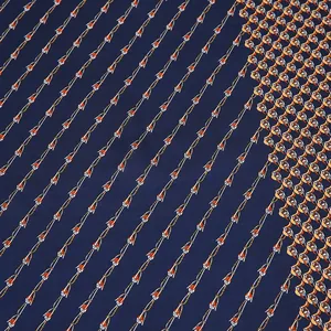 Detail of silk satin scarf with dark blue background and orange chain link patterns