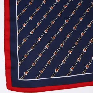 Close-up of geometric chain pattern and fine stitching on a silk satin square scarf