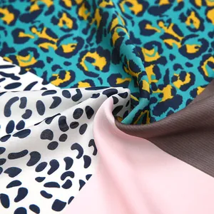 Macro shot of 53cm satin leopard print scarf showing silk texture and vibrant pattern
