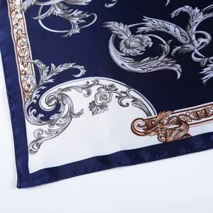 Close-up of Baroque patterned silk scarf with navy blue and white floral vintage print
