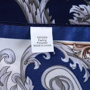Close-up of the 100% silk feeling polyester material label on a patterned scarf