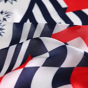 Detail of nautical square scarf showing red, white, and blue geometric star patterns