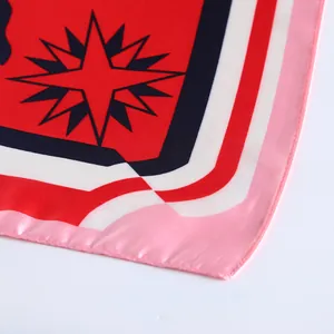 Detail of silk scarf with geometric compass pattern and premium stitched edges