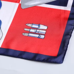 Detailed macro view of 53cm silk scarf with vibrant lipstick print and navy geometric pattern