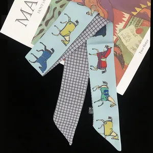 Sky blue twilly silk scarf with horse print and purple checkered pattern on dark background