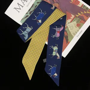 Double-sided twilly scarf with horse patterns and yellow plaid on a black background
