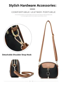 Detail of detachable shoulder strap with golden metal hardware on a round crossbody bag
