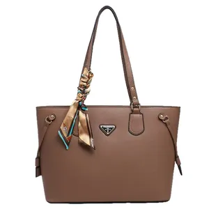 Large brown lychee grain leather tote bag with silk scarf and metal triangle plate