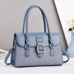 Sac à main bleu-gris élégant avec boucle en strass et bandoulière amovible incluse
