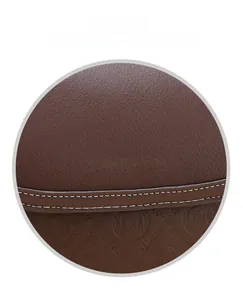 Detail of dark brown leather handbag with YIFENGLU metal logo and embossed patterns