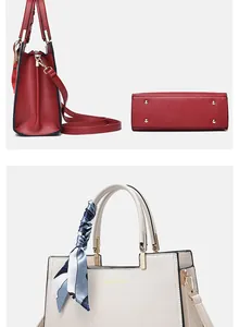 Detail of elegant top-handle bags with lychee texture leather and metal bottom studs