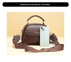 Size comparison between the brown faux leather bag and an iPhone 12 Pro Max