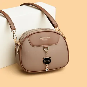 Fashionable round crossbody bag for women in coffee and light brown synthetic leather