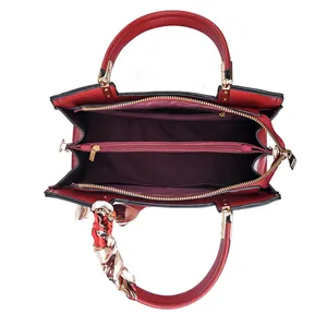 Elegant red wedding handbag with three compartments and decorative floral handle scarf