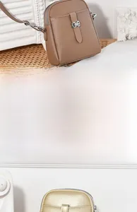 Macro detail of lychee texture faux leather handbag with dual zipper and metal hardware